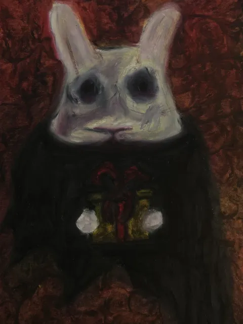 贈り物を抱くウサギ